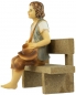 Preview: Handbemalte Krippenfigur Junge sitzend inkl. Bank, ca. 9 cm, K 001-28